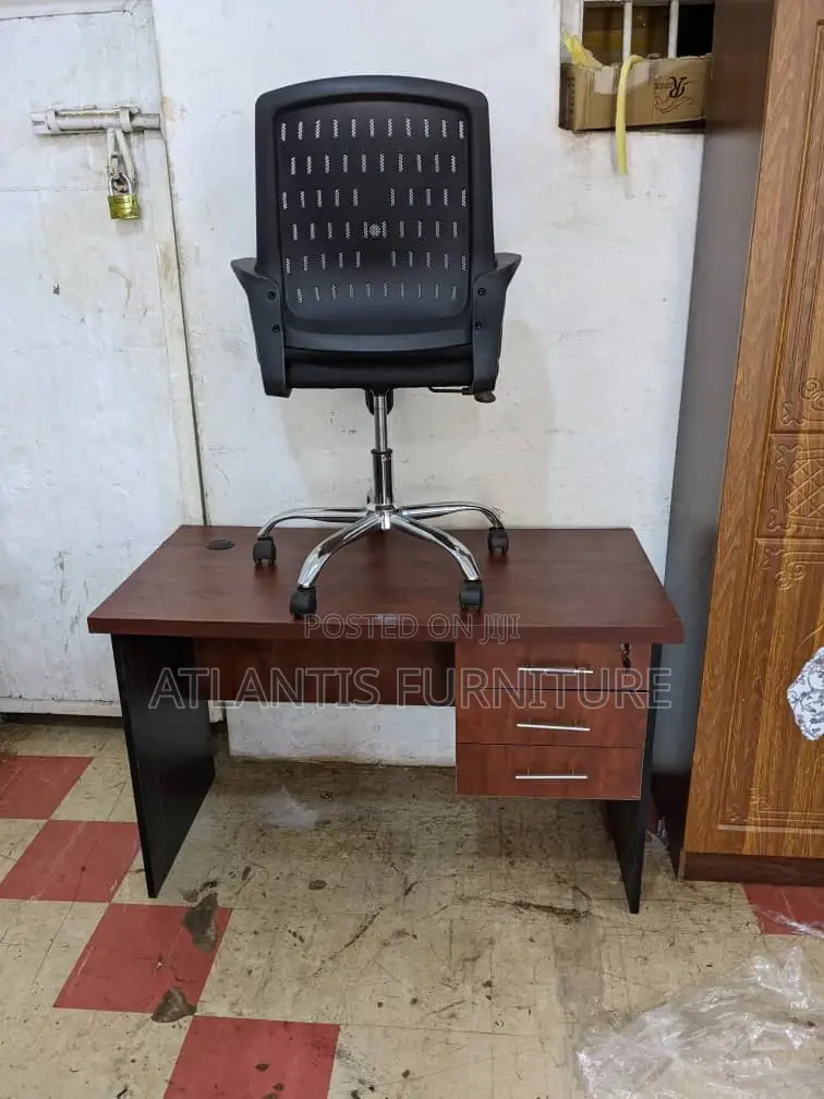 A Office Desk With Mesh Chair