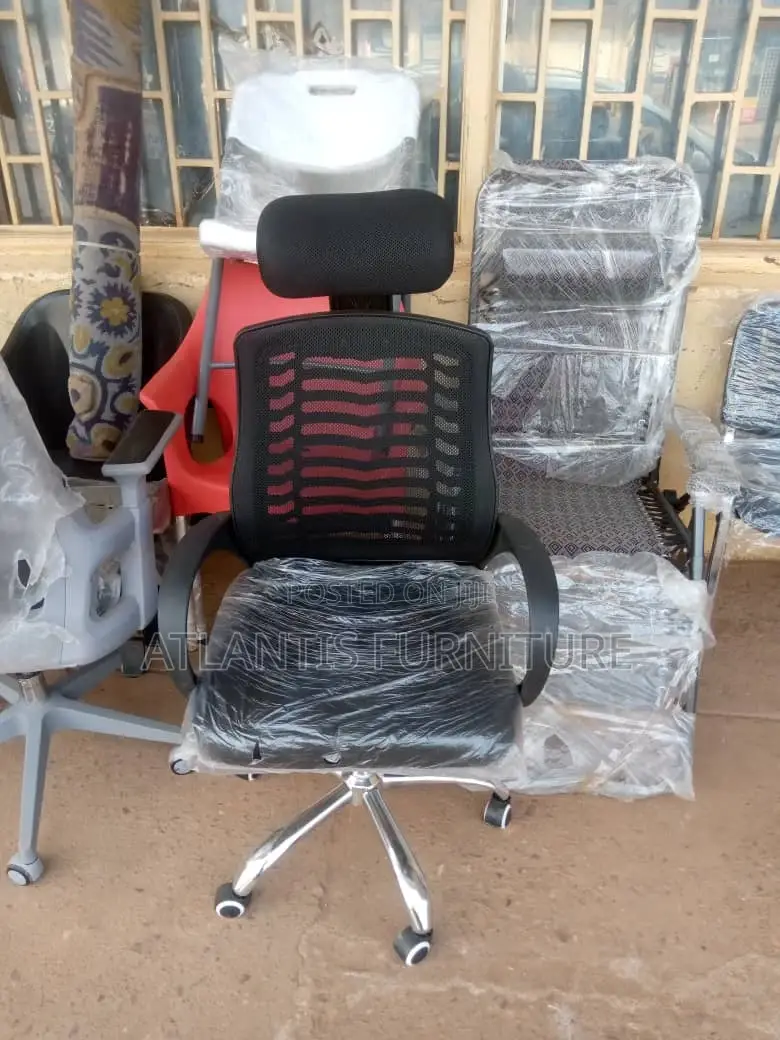 An Office Mesh Chair With Headrest