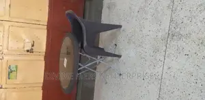 Folded Steel Leg Round Table and a Chair