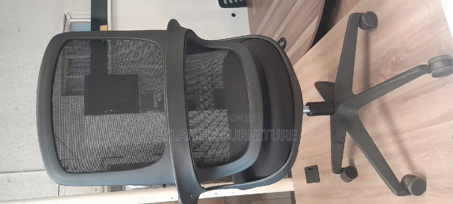 An Extraordinary Netted Office Chair With Arms