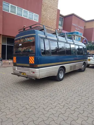 New Toyota Coaster 2003 Grey for Hire Per Day