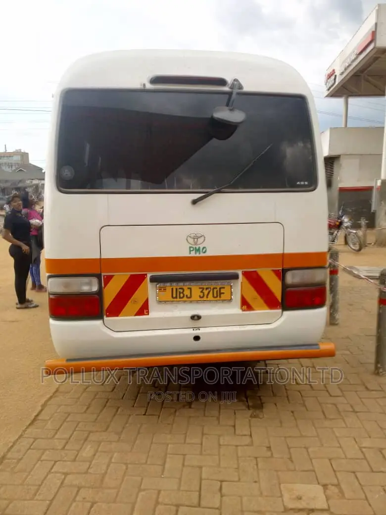 New Toyota Coaster 2003 Grey for Hire Per Day