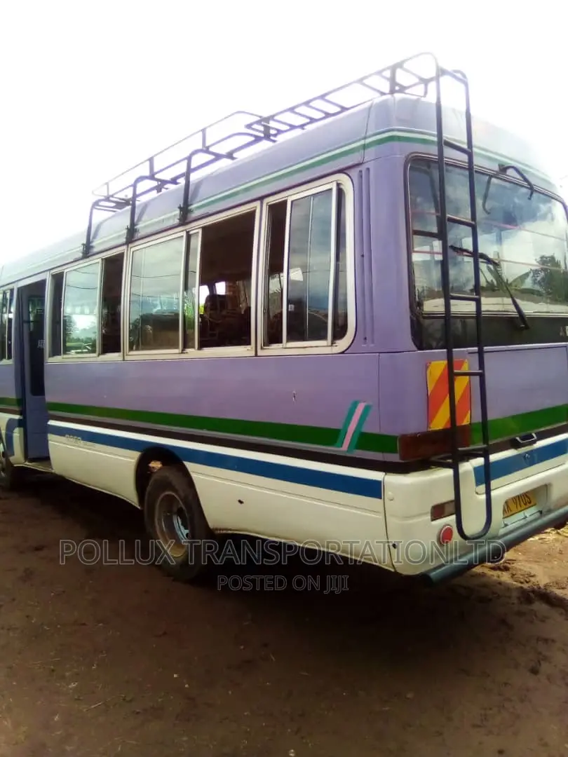 New Toyota Coaster 2003 Grey for Hire Per Day