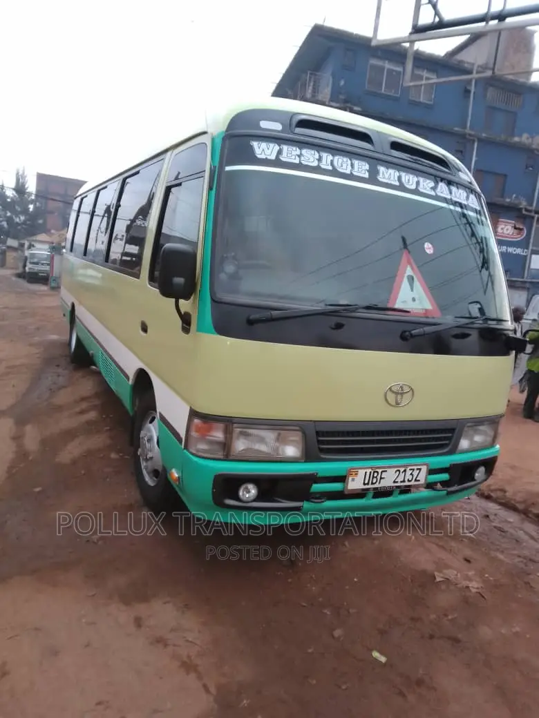 New Toyota Coaster 2003 Grey for Hire Per Day