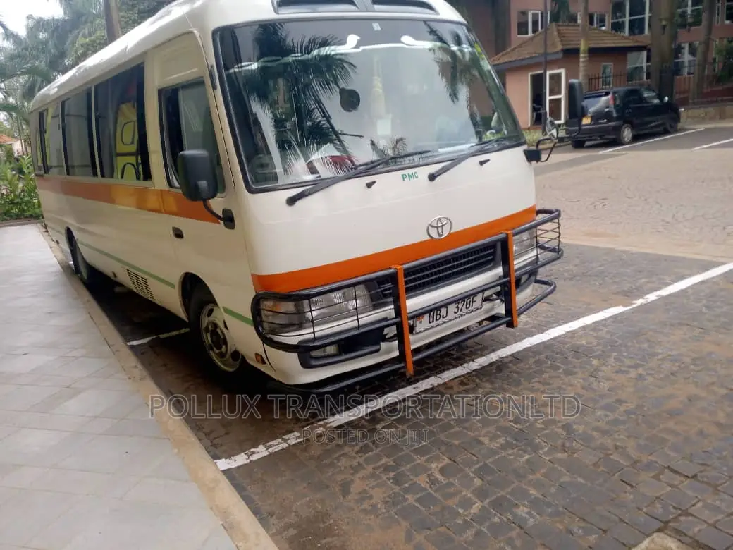 New Toyota Coaster 2003 Grey for Hire Per Day