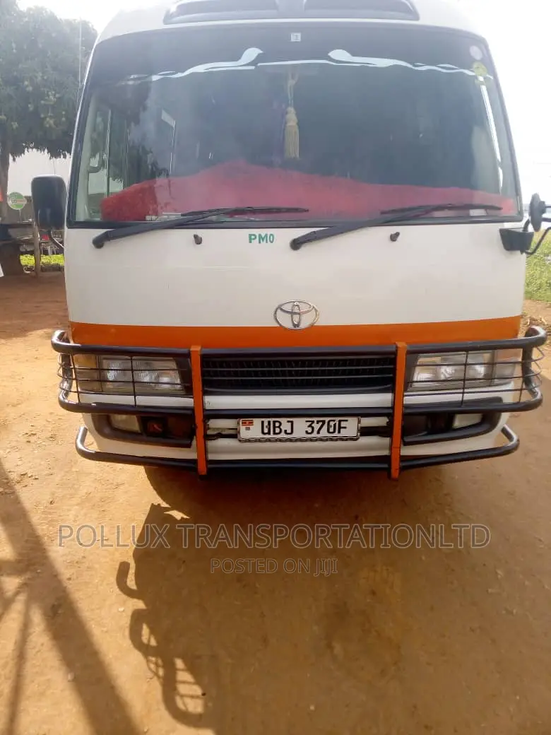 New Toyota Coaster 2003 Grey for Hire Per Day