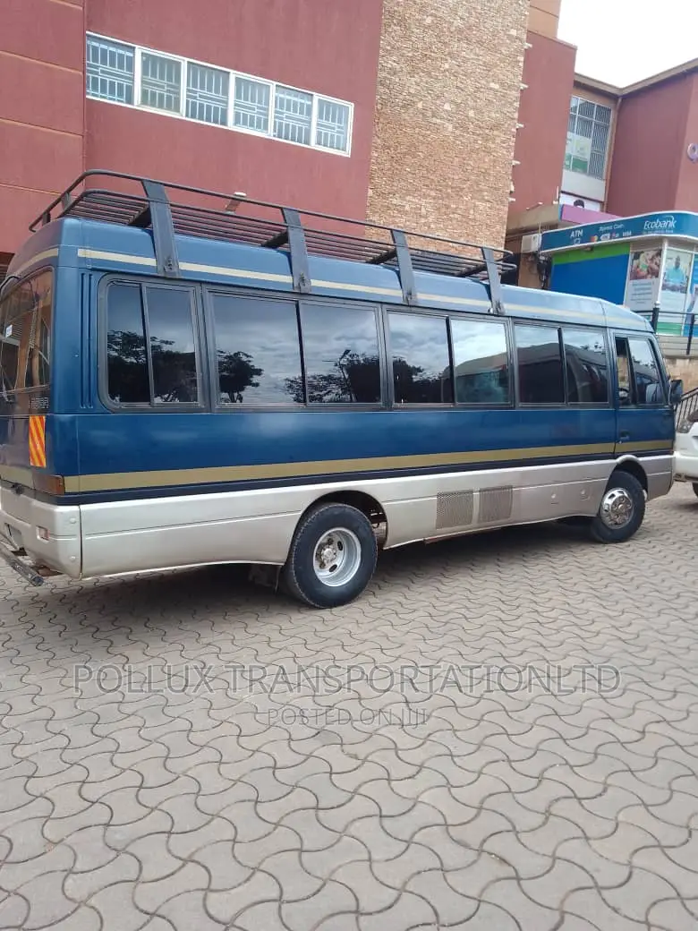 New Toyota Coaster 2003 Grey for Hire Per Day