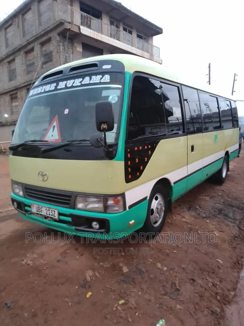 New Toyota Coaster 2003 Grey for Hire Per Day