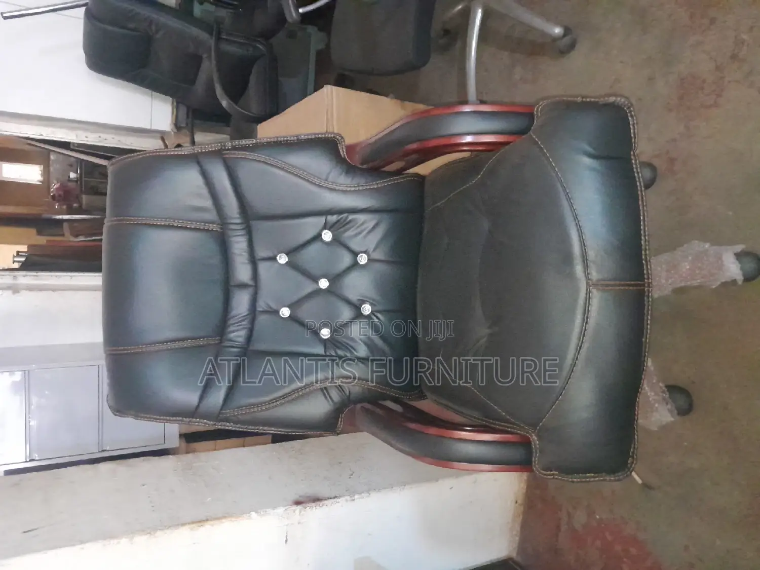 A Highend Executive Leather Office Chair With Wooden Legs