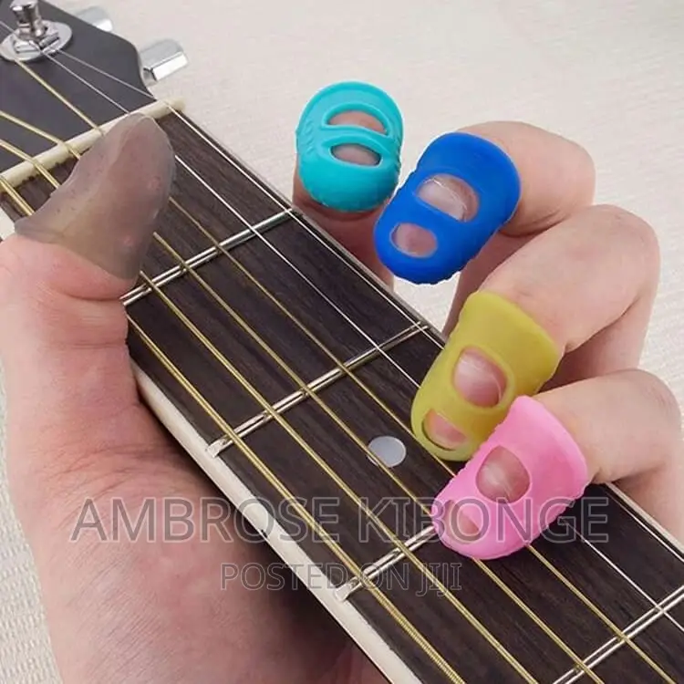 4pcs Guitar String Fingertip Guard Protector Silicone Press.