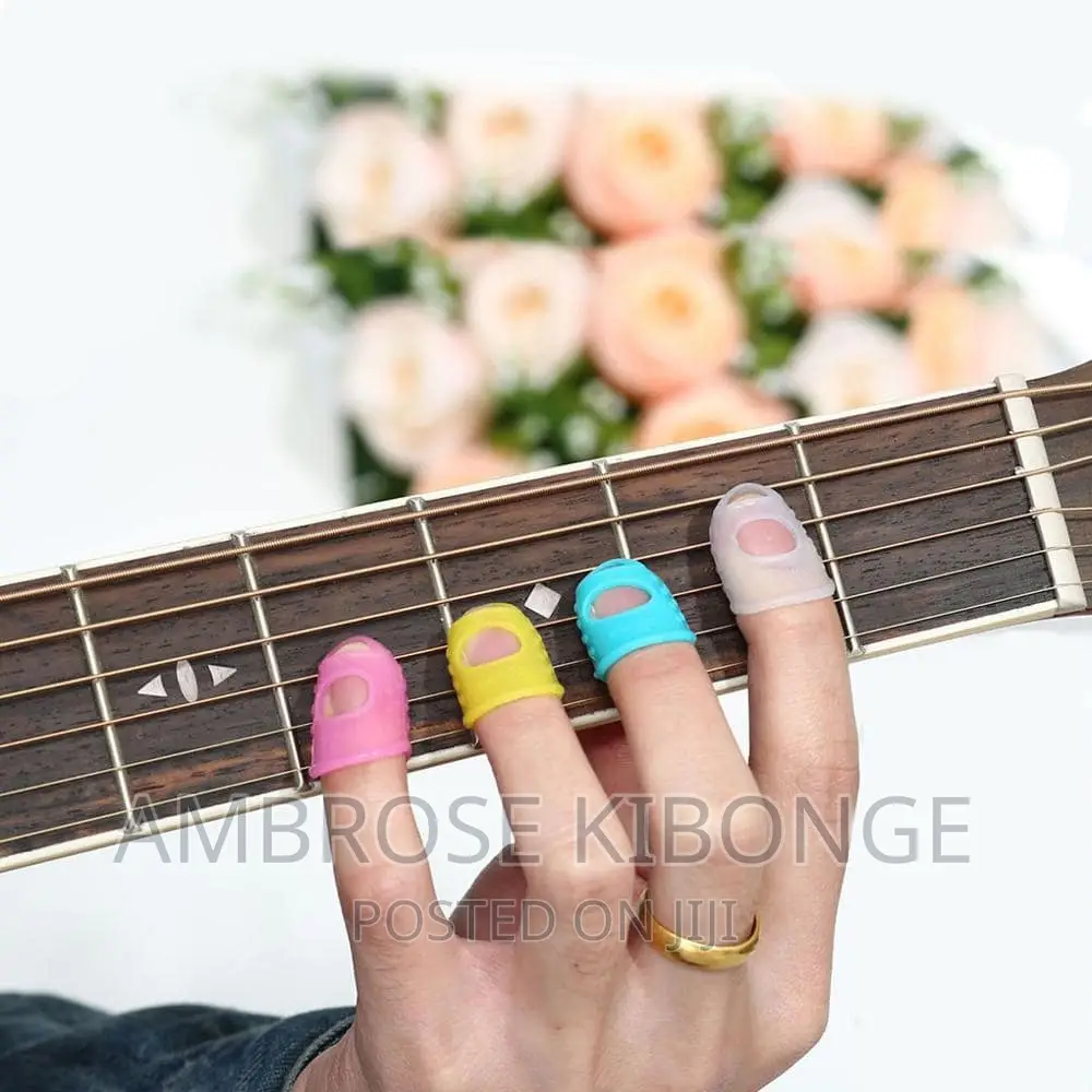 4pcs Guitar String Fingertip Guard Protector Silicone Press.