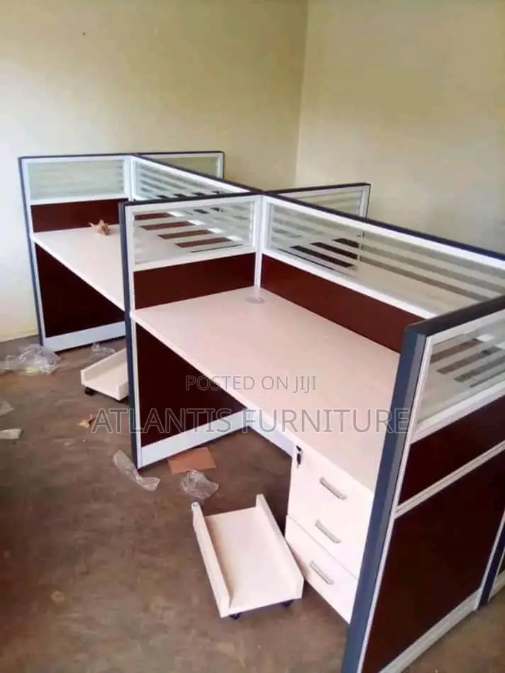 A Four Seater Workstation With Straight Tops and Drawers