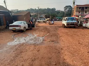 Acre of Land on Main Road in Kyengera Town.