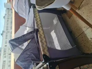 Baby Crib With Breathable Net and Rollers