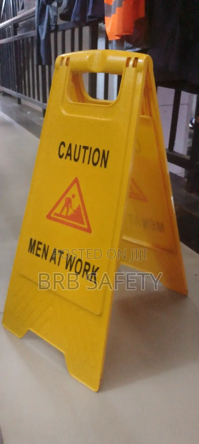 Caution Signage. Men At Work