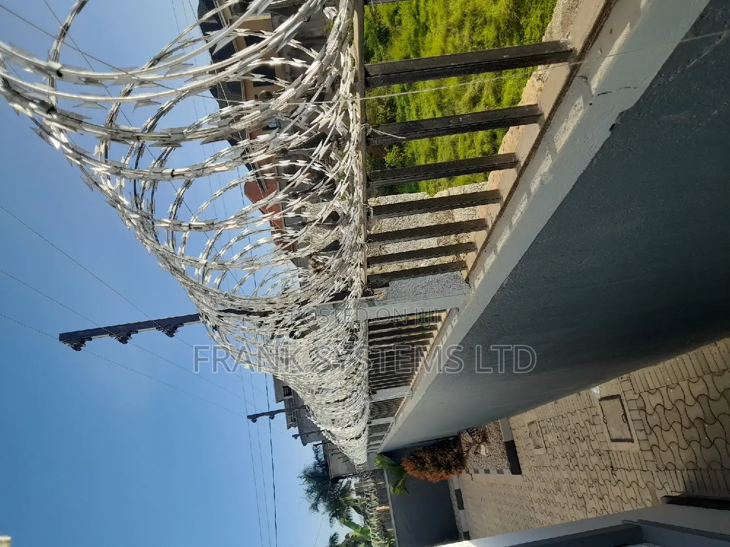Electrified Fence System Backup With Razor Wire.