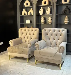 Photo - Two Wing Back Chesterfield Sofas