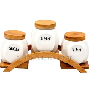 Sets of Tea, Sugar and Coffee Containers With a Wooden Rack