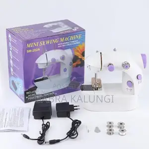 Photo - Mini Electric Sewing Machine