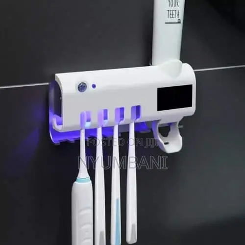 Tooth Paste Dispenser And Sterilizer