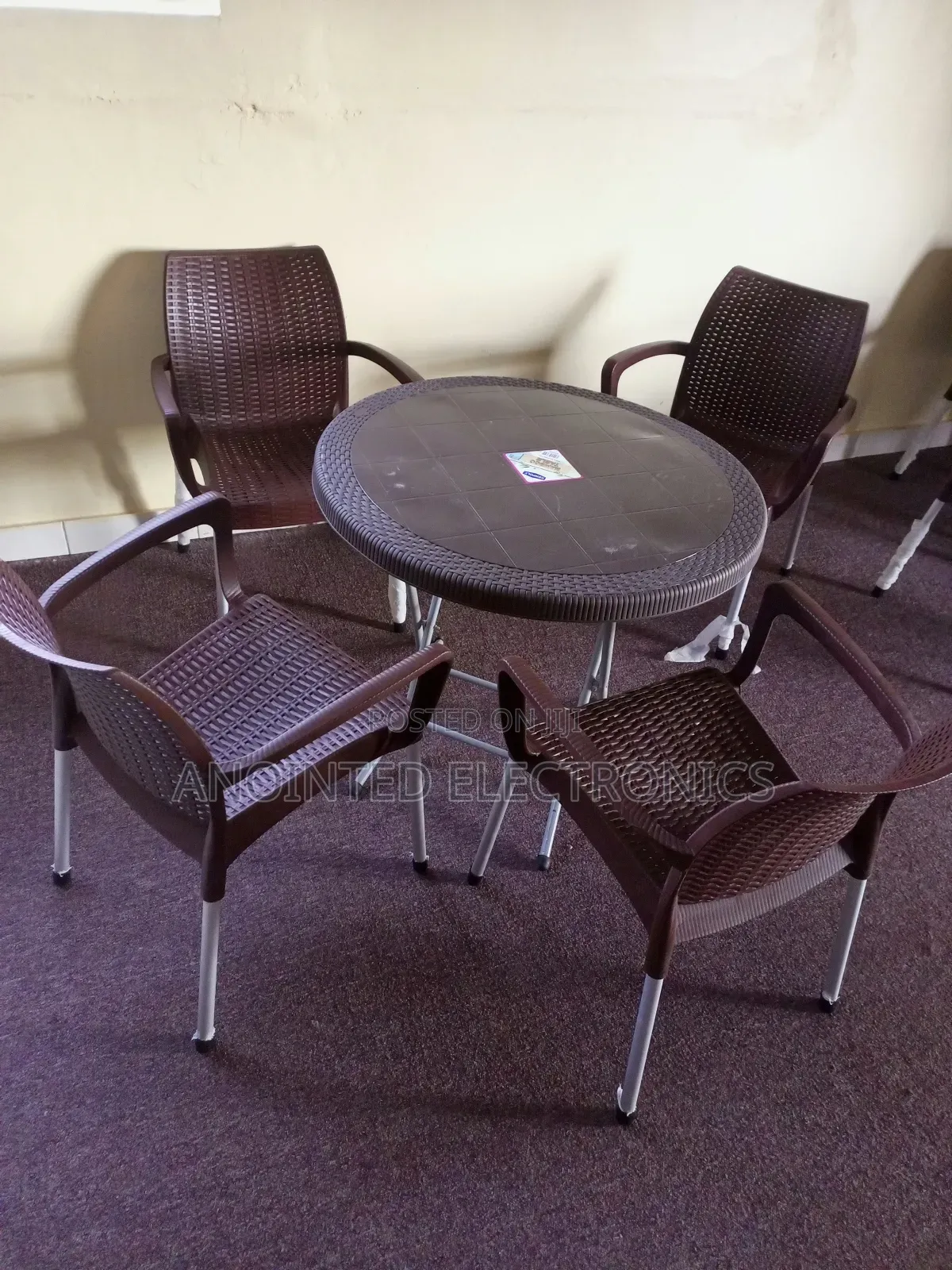 A Set of Plastic Table With Four Chairs
