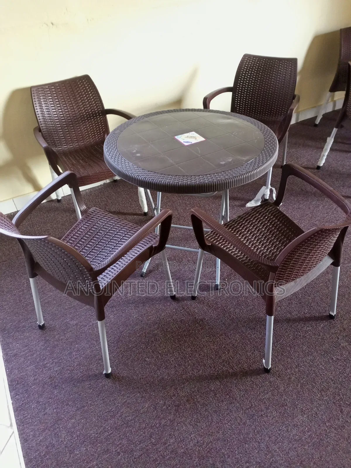 A Set of Plastic Table With Four Chairs