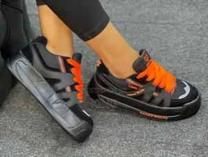 Naked Wolfe Sneakers. Black Mid Orange