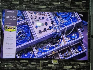 Photo - Used Samsung 55" Q8C Curved Smart TV