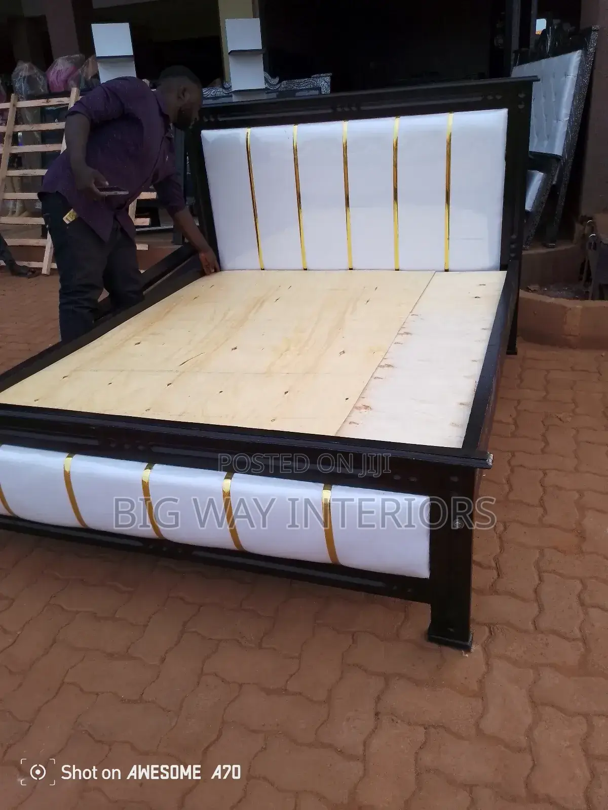 5 by 6 White Leather Bed With Gold Stickers