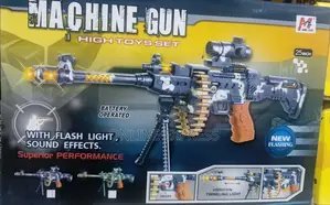 Photo - Kids Firing Toy Machine Gun
