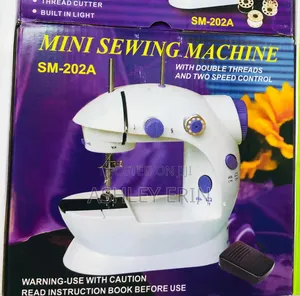 Photo - New Portable Mini Cloth Sewing Machine