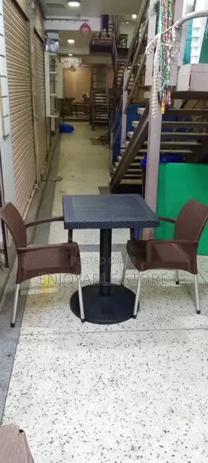 Black Table and 2 Brown Chairs