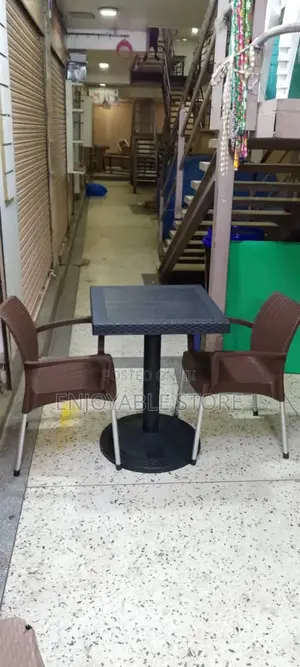 Black Table and 2 Brown Chairs