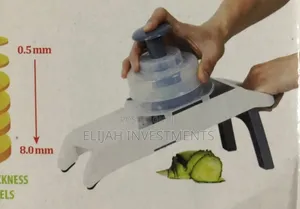 New Hand Held Vegetable Grater