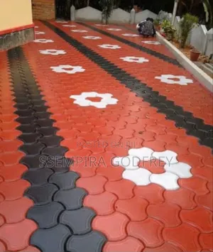 Installation of Coloured Pavers and Structual Land Scape.