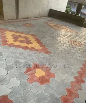 Installation of Coloured Pavers and Structual Land Scape.