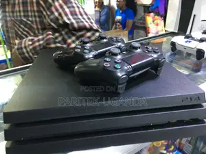 Playstation Ps4 Pro Console With 2 Pads 10 Games