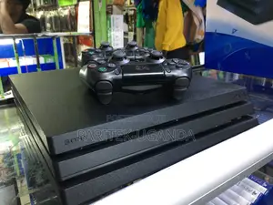 Ps4 Pro Console W/ 2 Pads +10 Games + 02 Controllers