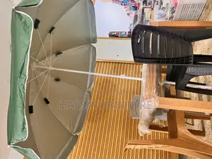 Umbrella and Table Plus Chairs