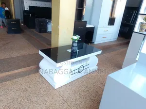 Photo - Modern Wooden Center Table With a Glass Top