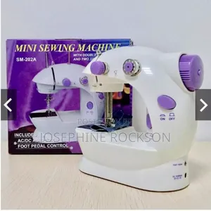 Photo - Electric Mini Sewing Machine