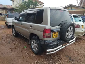 Photo - Mitsubishi Pajero IO 2003 Gold