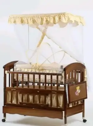 Photo - Brown With Yellow Wooden Baby Cot