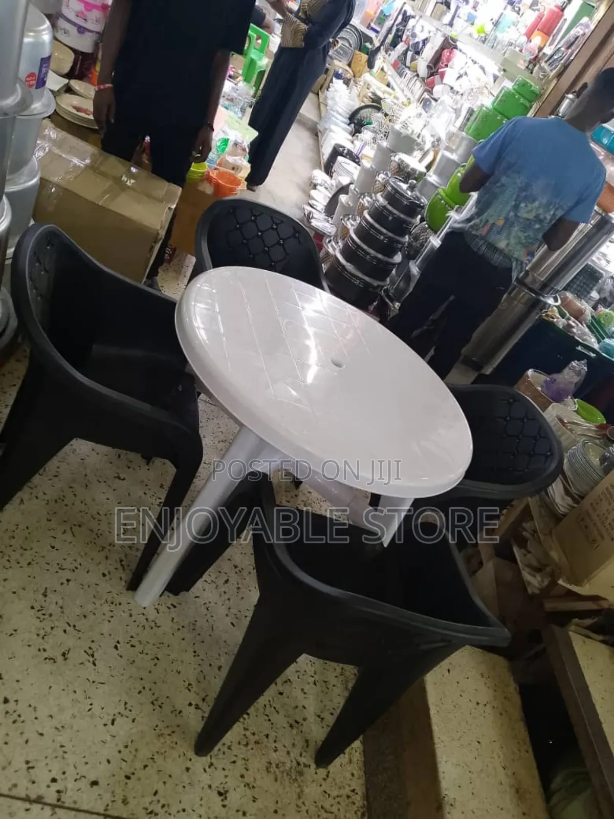 A Set of Bar Plastic Sofa Chairs and Table