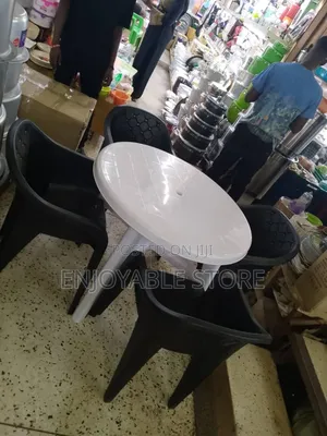 A Set of Bar Plastic Sofa Chairs and Table