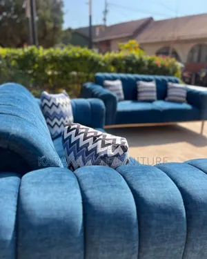 Sofa With a Playful Rug to Make Your Living Room Warm
