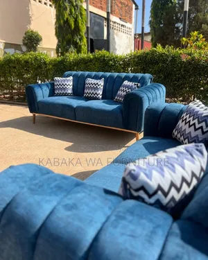 Sofa With a Playful Rug to Make Your Living Room Warm