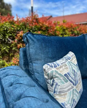 Sofa With a Playful Rug to Make Your Living Room Warm
