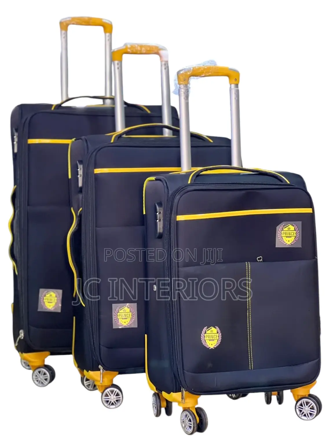 A Set of 3 Black Suitcases