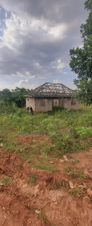 Titled 1.39 Acres With Unfinished House in It Good View